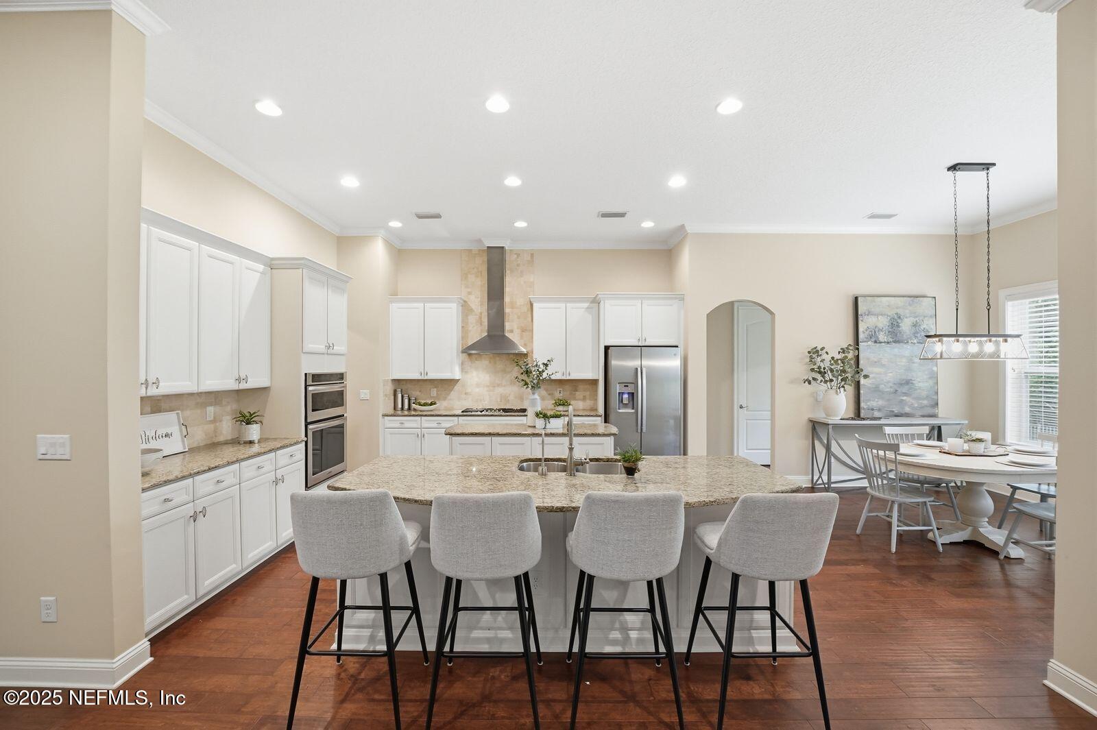 524 Sebastian Square St. Augustine, FL 32095 - Photo 3 of 32 a large kitchen with a table and chairs