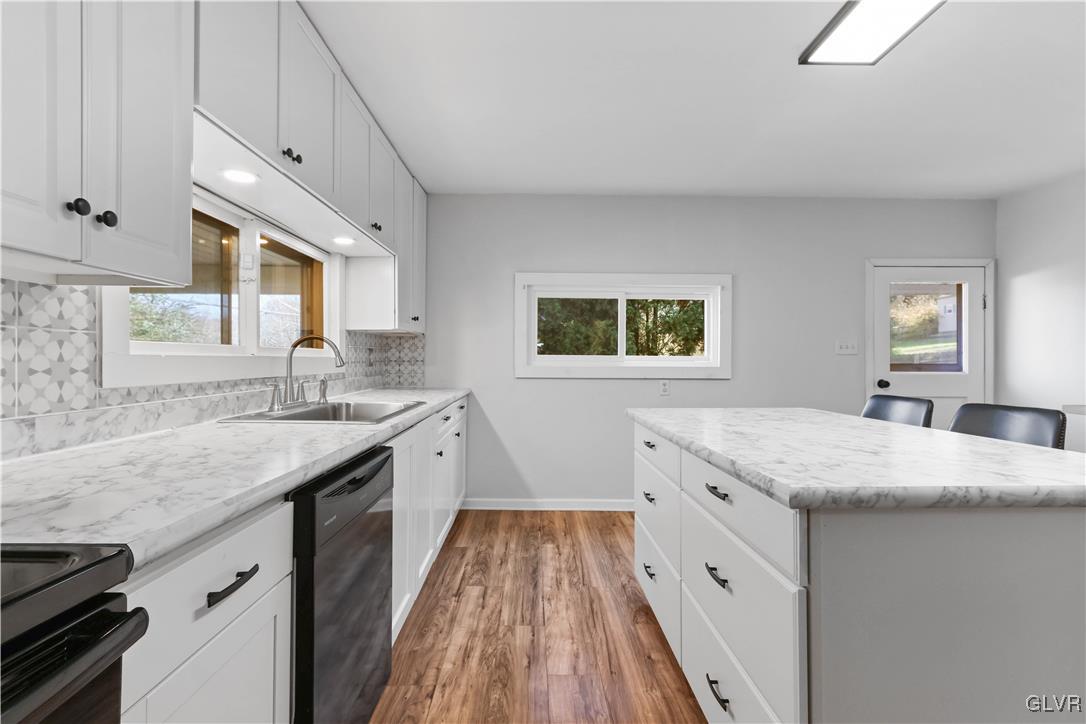 1802 Moselem Spring Road Hamburg, PA 19526 - Photo 13 of 50 a kitchen with a sink stove and cabinets