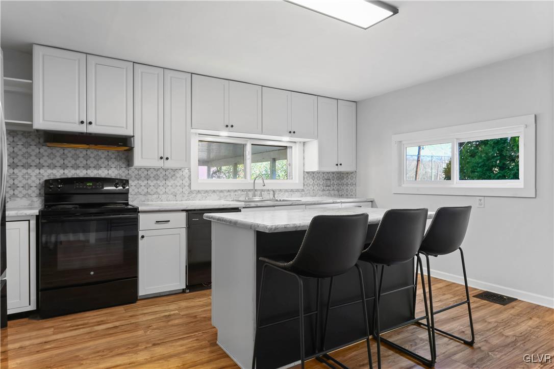 1802 Moselem Spring Road Hamburg, PA 19526 - Photo 15 of 50 a kitchen with a sink cabinets and window