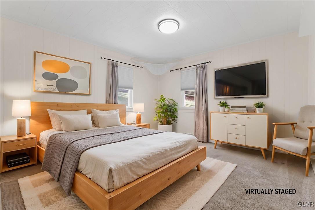 1802 Moselem Spring Road Hamburg, PA 19526 - Photo 18 of 50 a bedroom with a bed and a flat screen tv
