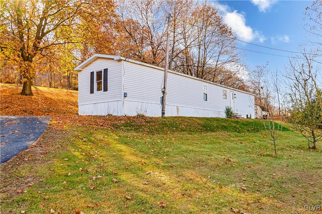 1802 Moselem Spring Road Hamburg, PA 19526 - Photo 29 of 50 a white house that has a tree in front of it