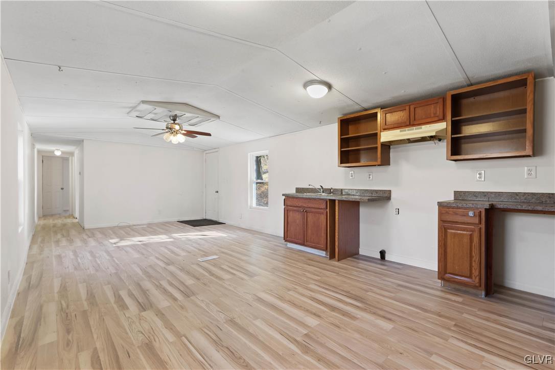1802 Moselem Spring Road Hamburg, PA 19526 - Photo 33 of 50 a view of kitchen and empty room with wooden floor
