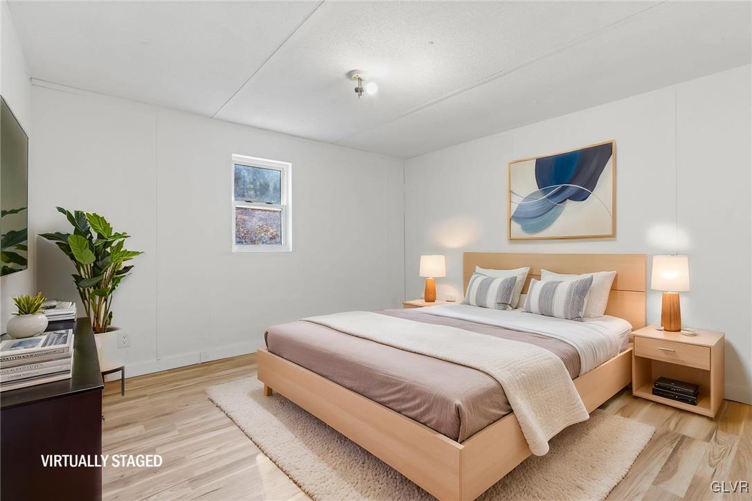 1802 Moselem Spring Road Hamburg, PA 19526 - Photo 35 of 50 a bedroom with a bed and a potted plant