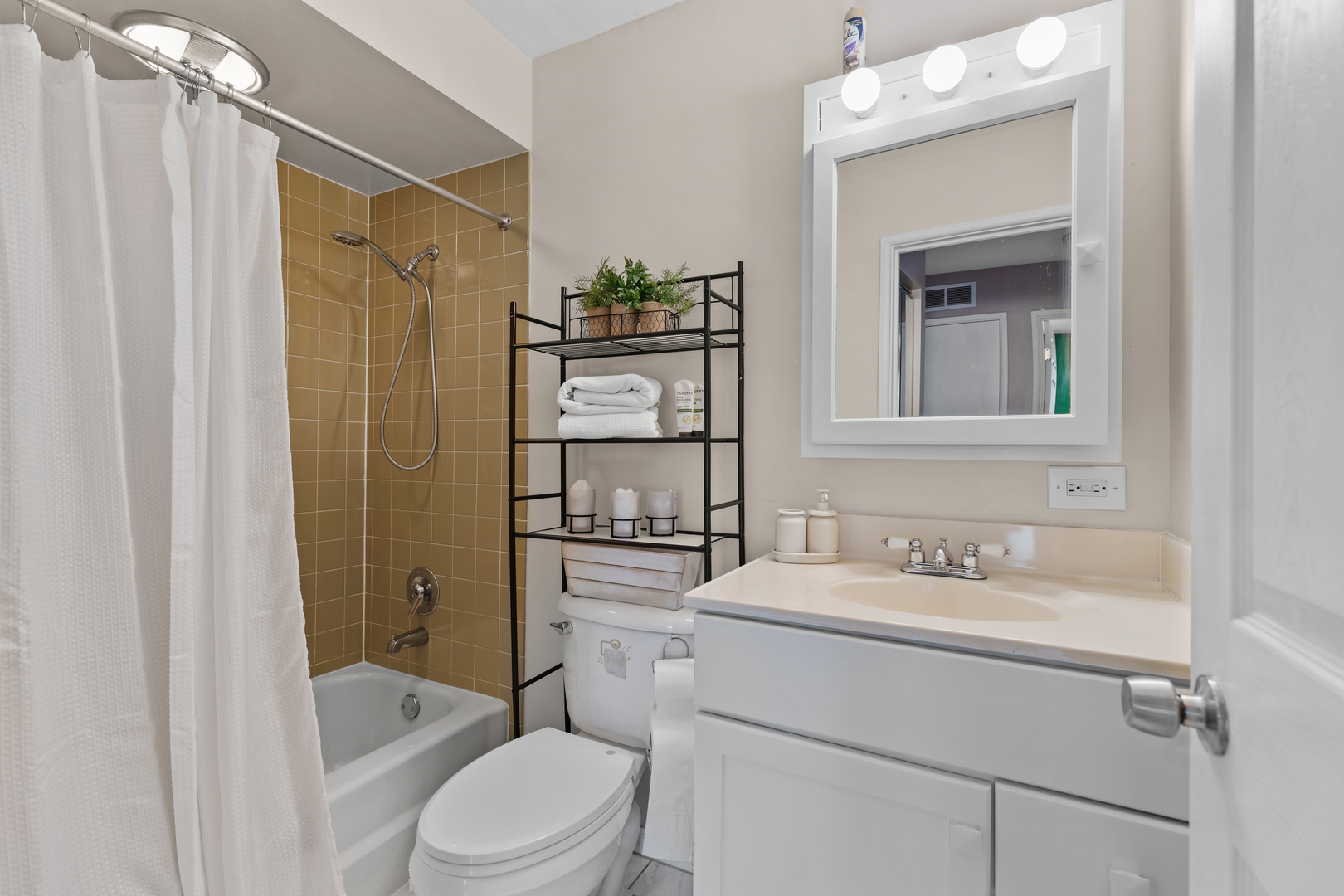 7353 Blackburn Avenue, Unit K206 Downers Grove, IL 60516 - Photo 11 of 24 a bathroom with a sink toilet and shower
