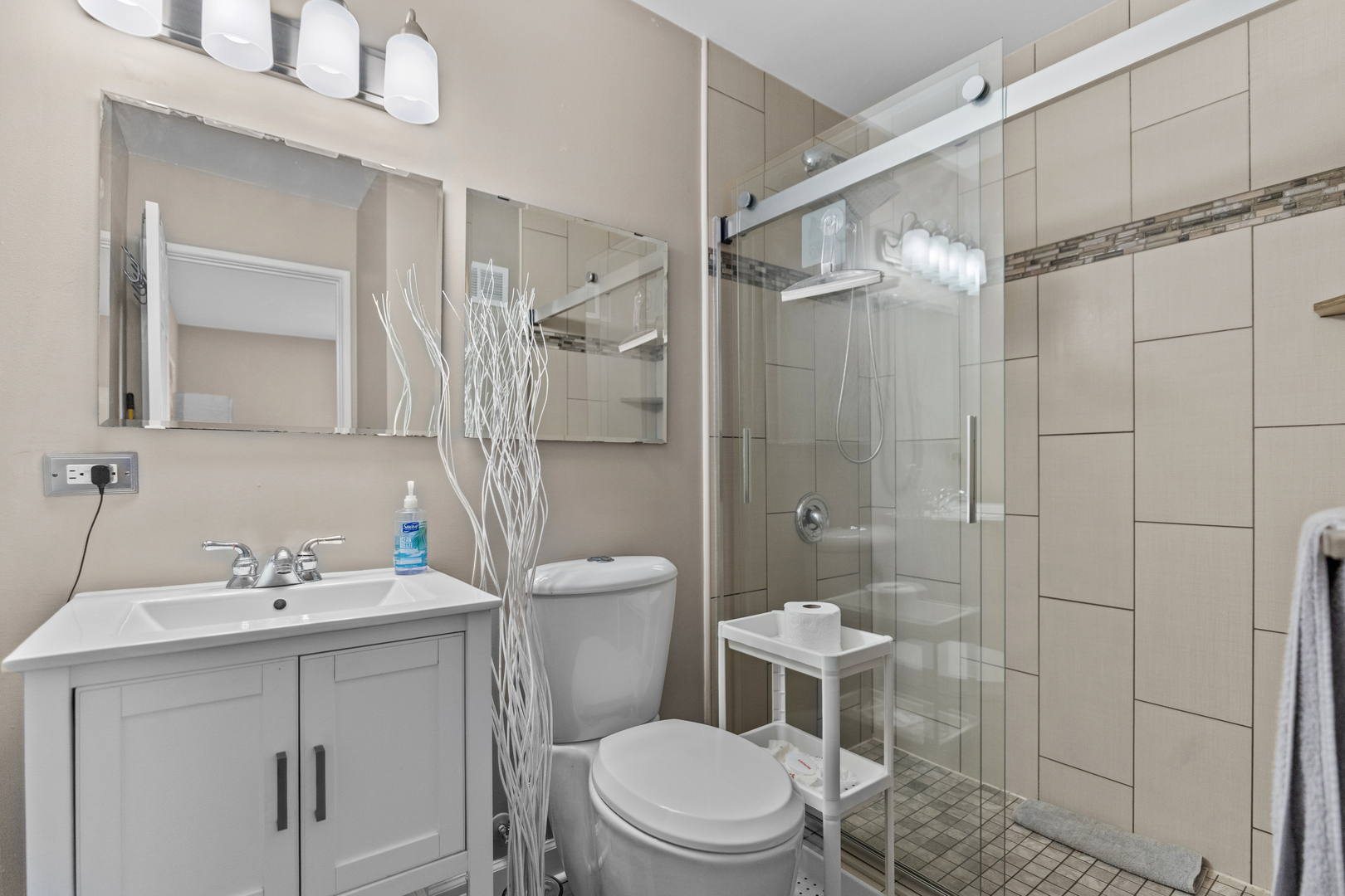 7353 Blackburn Avenue, Unit K206 Downers Grove, IL 60516 - Photo 19 of 24 a bathroom with a sink a toilet and shower