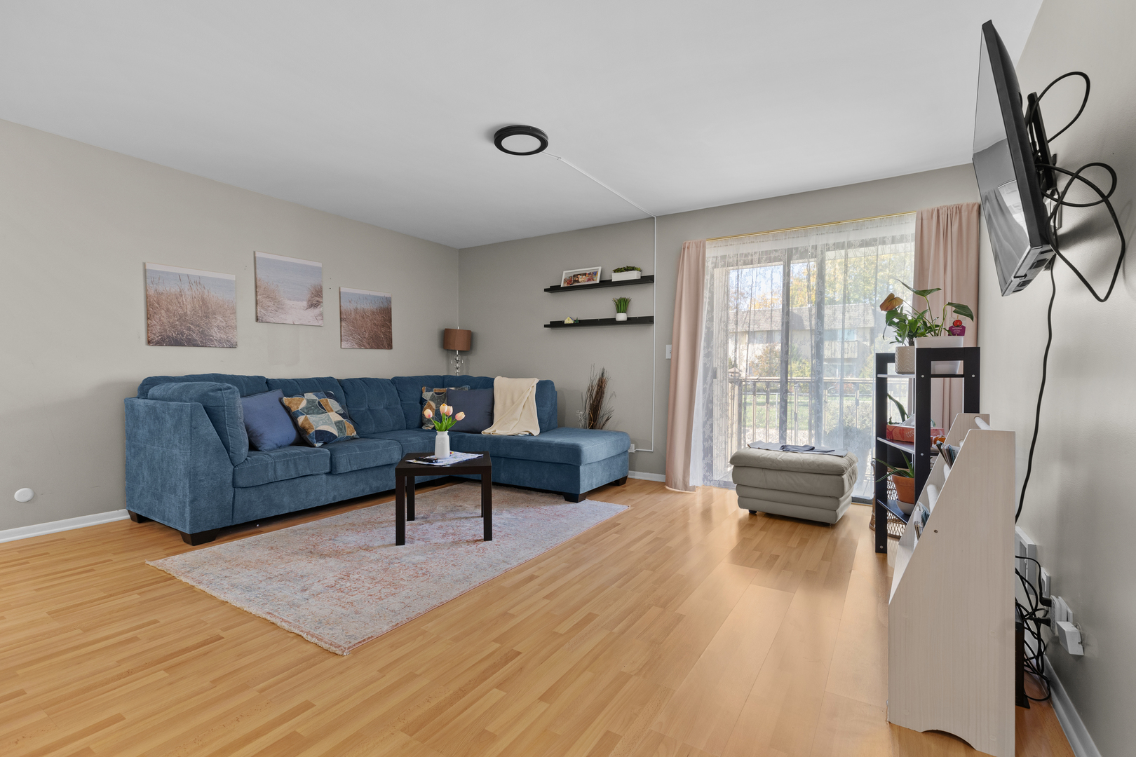 7353 Blackburn Avenue, Unit K206 Downers Grove, IL 60516 - Photo 3 of 24 a living room with furniture and a wooden floor