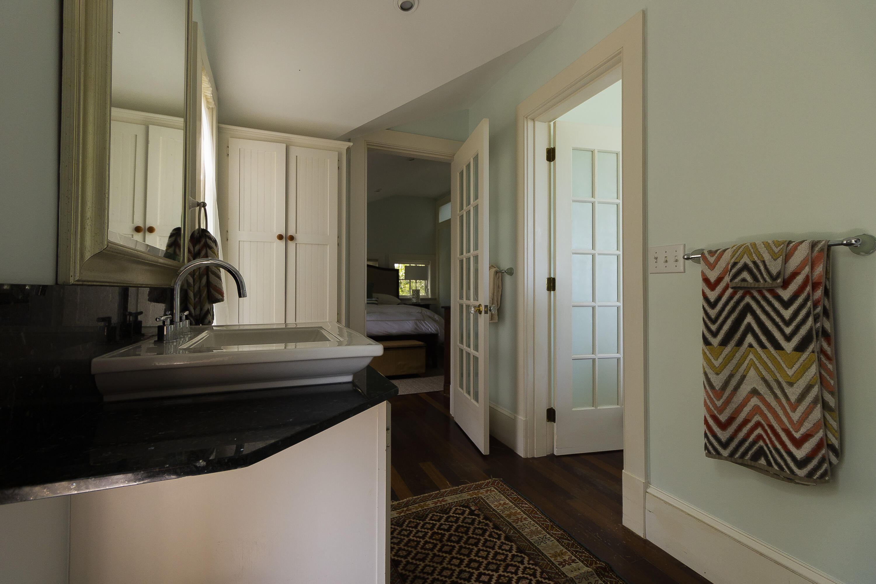 101 Associates Road Falmouth, MA 02540 - Photo 14 of 16 a bathroom with a sink and a mirror