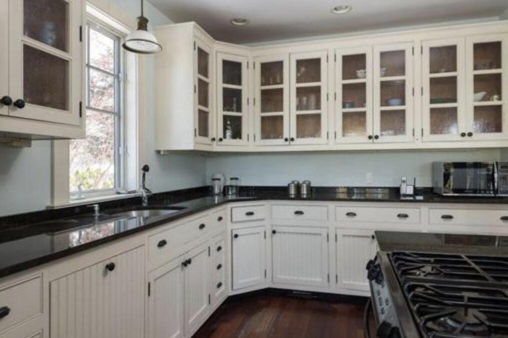 101 Associates Road Falmouth, MA 02540 - Photo 7 of 16 a kitchen with granite countertop white cabinets and sink