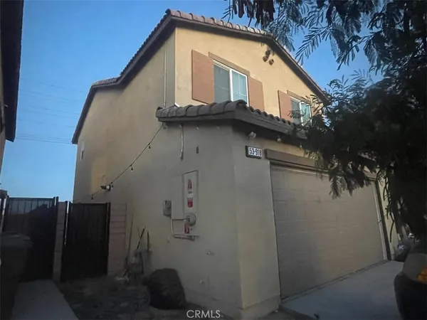a view of a house with a small yard