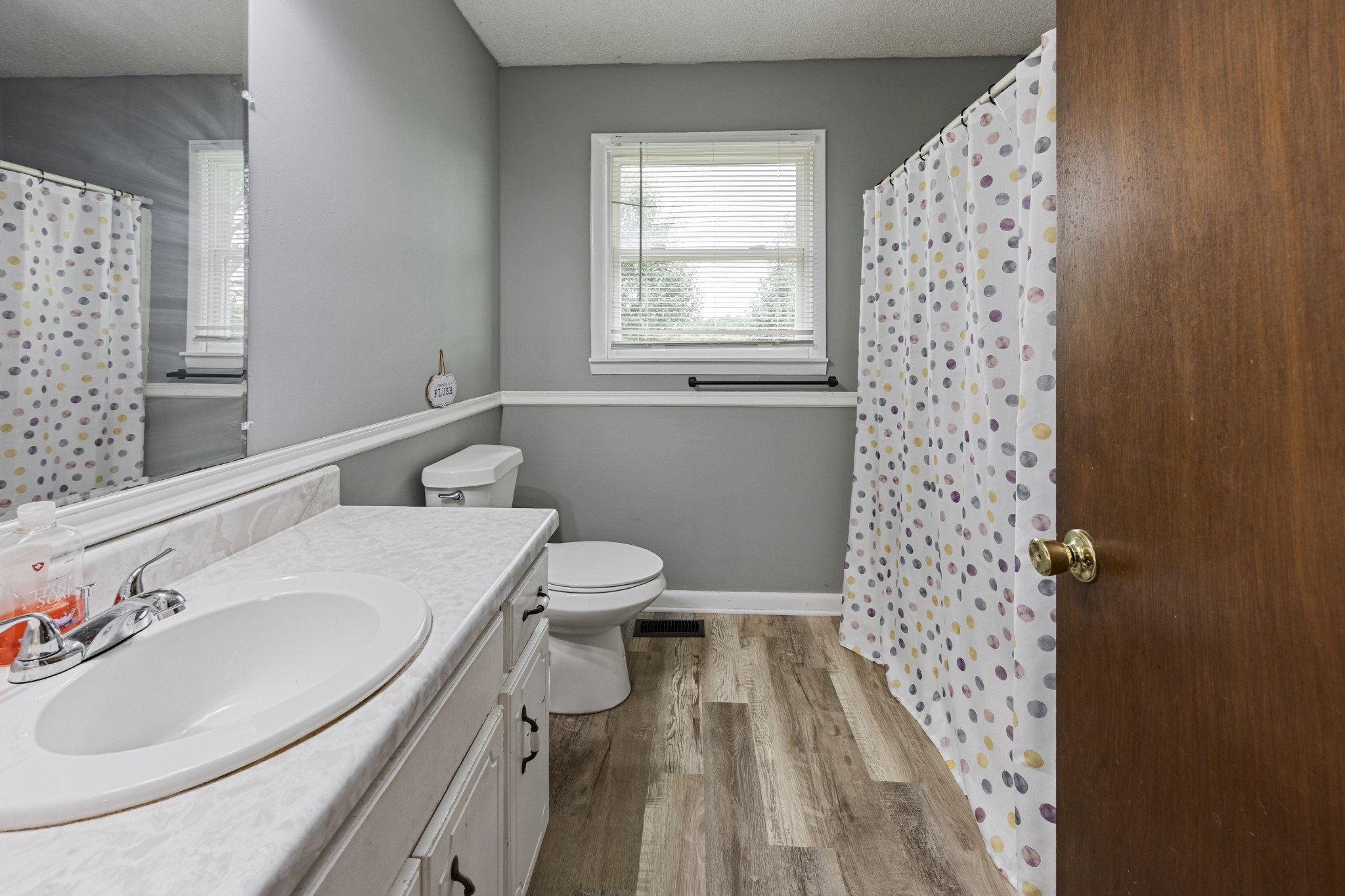 421 Shady Grove Road Flintville, TN 37335 - Photo 13 of 33 a bathroom with a sink toilet and window