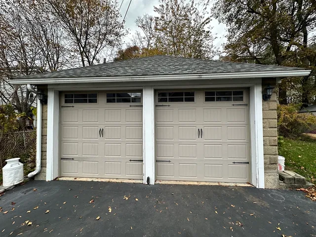 a front view of a house with a garage