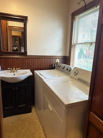 a bathroom with a window and a shower