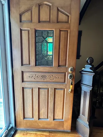 a view of empty room with wooden walls