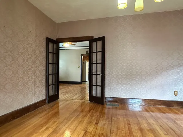 a view of livingroom with window and wooden floor