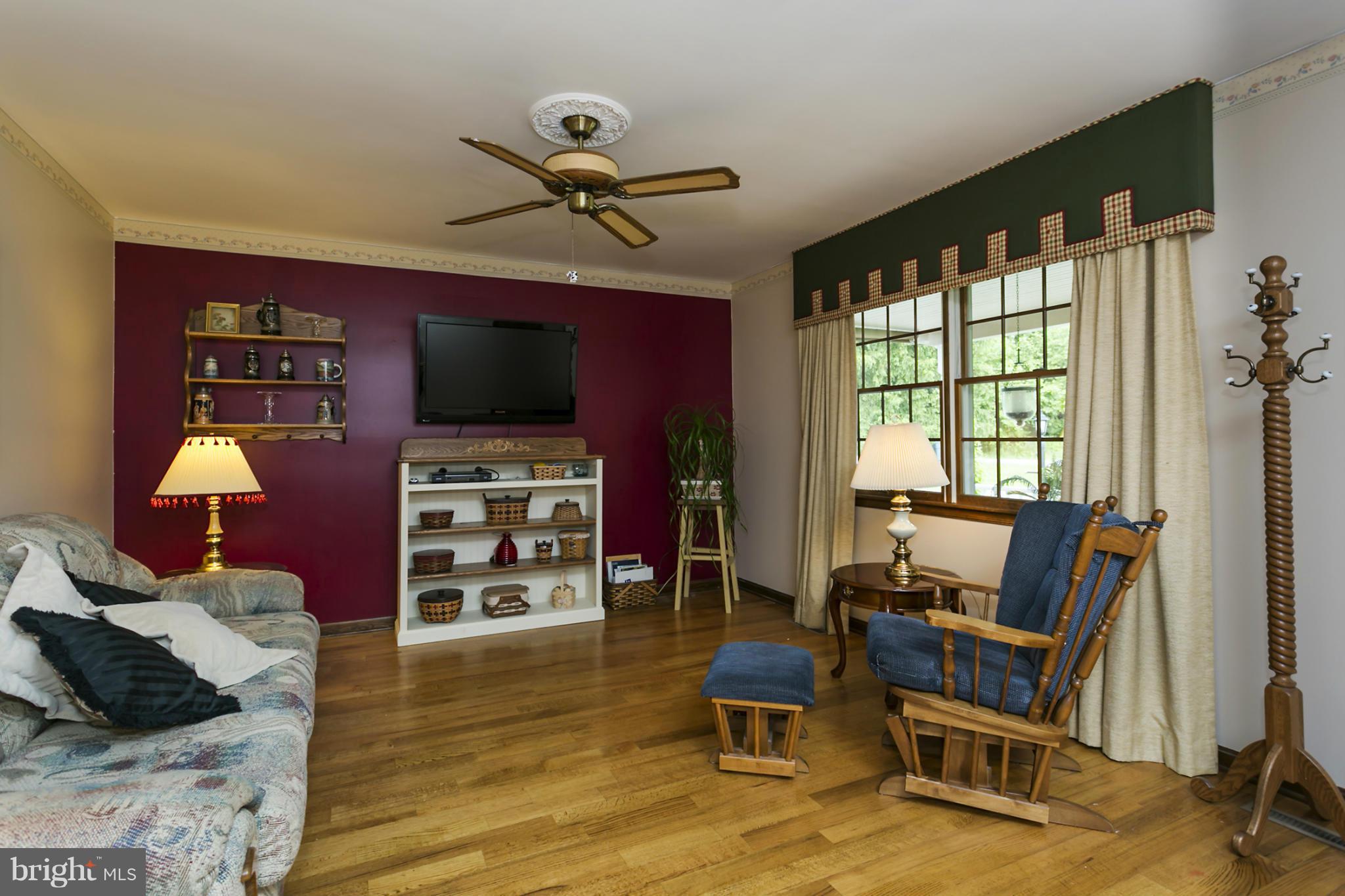 10009 German Road Ellicott City, MD 21042 - Photo 3 of 27 a view of a livingroom with furniture and a flat screen tv