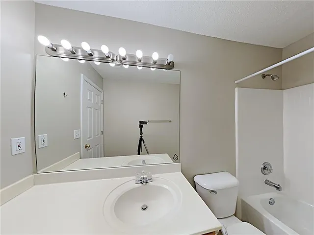 a bathroom with a sink double vanity and a mirror