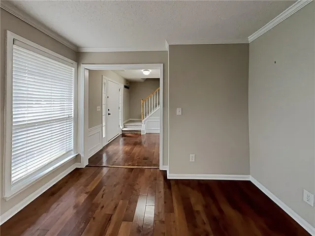 a view of a livingroom with wooden floor