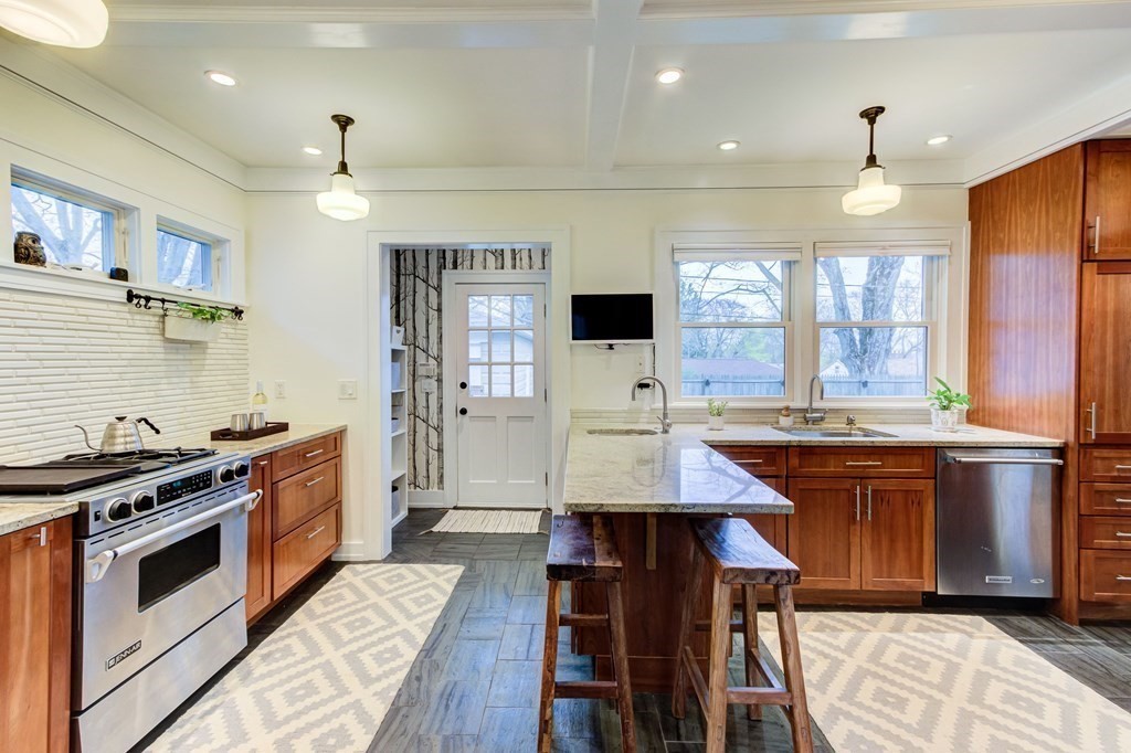 109 Morningside Road Worcester, MA 01602 - Photo 21 of 42 a kitchen with stainless steel appliances granite countertop a stove and a sink