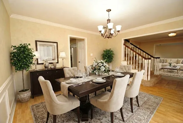 a view of a dining room with furniture window and wooden floor