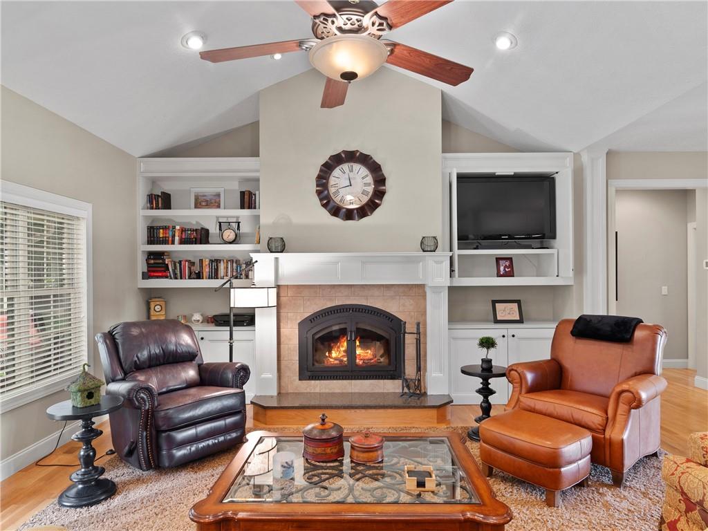 62 Vision Road Canton, NC 28716 - Photo 12 of 45 a living room with furniture a flat screen tv and a fireplace