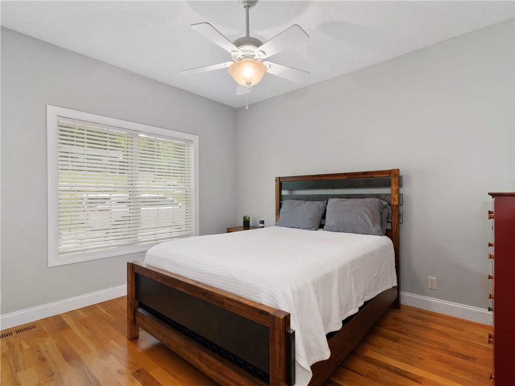 62 Vision Road Canton, NC 28716 - Photo 26 of 45 a bed sitting in a bedroom next to a window