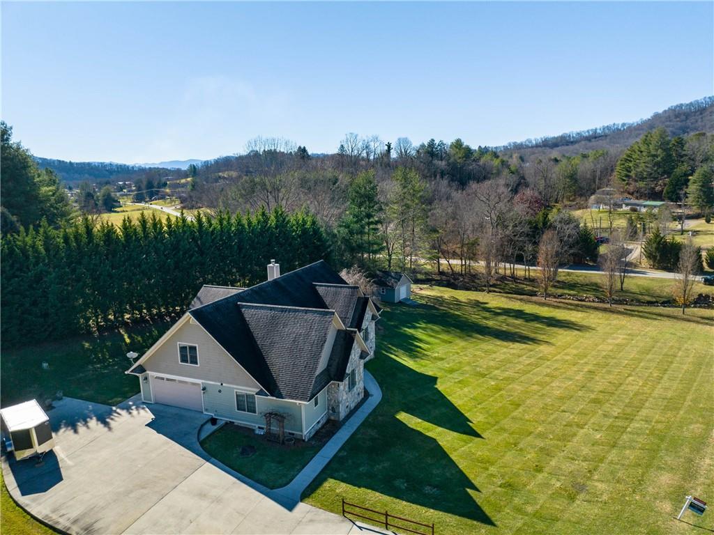 62 Vision Road Canton, NC 28716 - Photo 38 of 45 a view of a house with pool and a yard