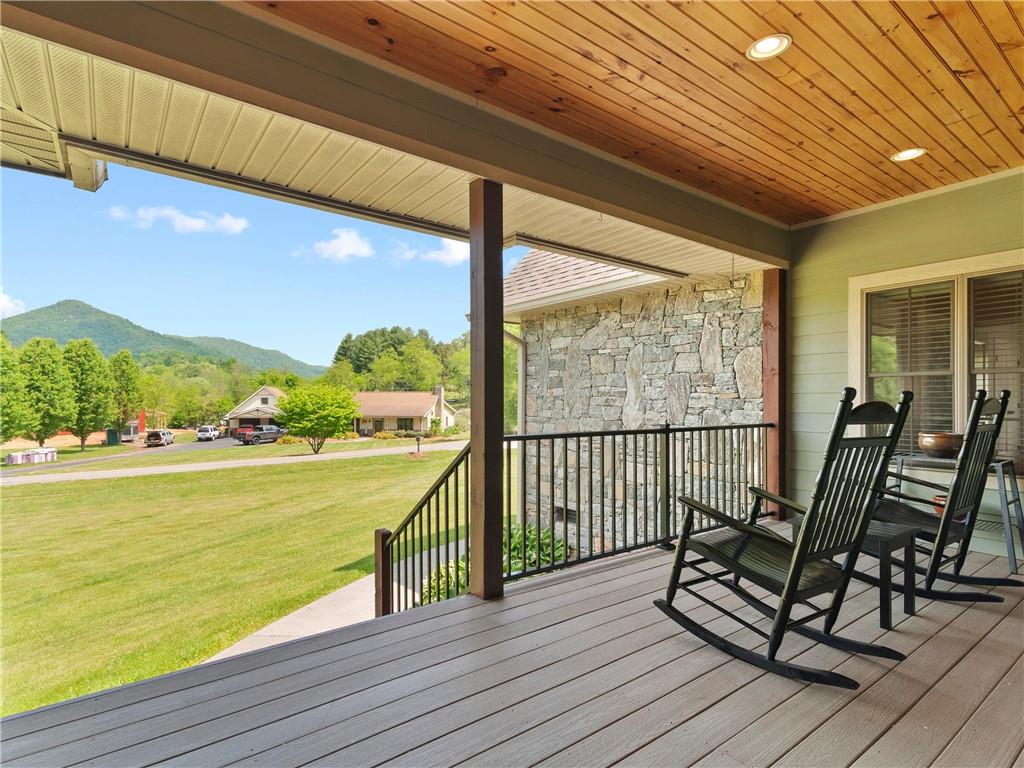 62 Vision Road Canton, NC 28716 - Photo 6 of 45 a view of a balcony with chair and wooden floor