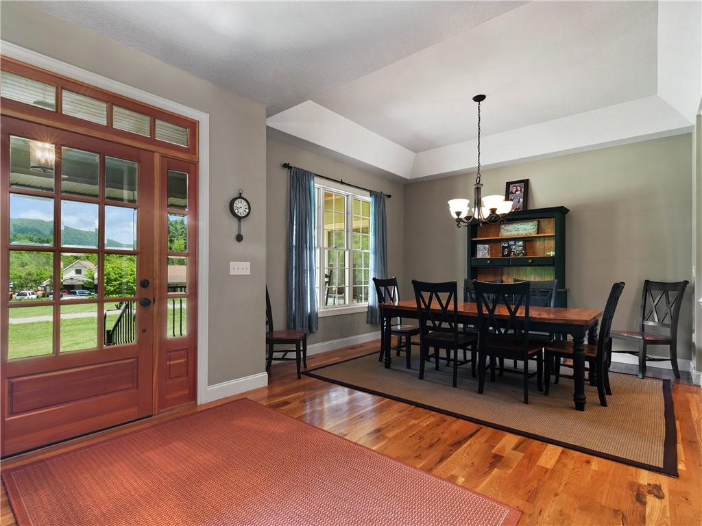 62 Vision Road Canton, NC 28716 - Photo 8 of 45 a view of a dining room with furniture window and wooden floor