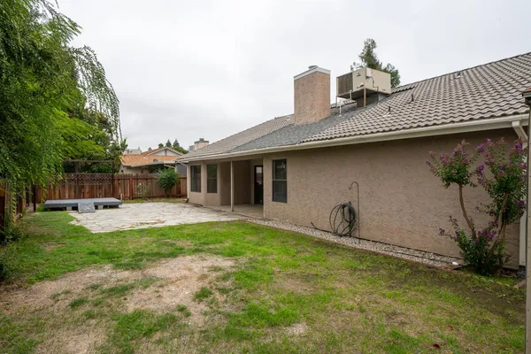 a house view with a garden space