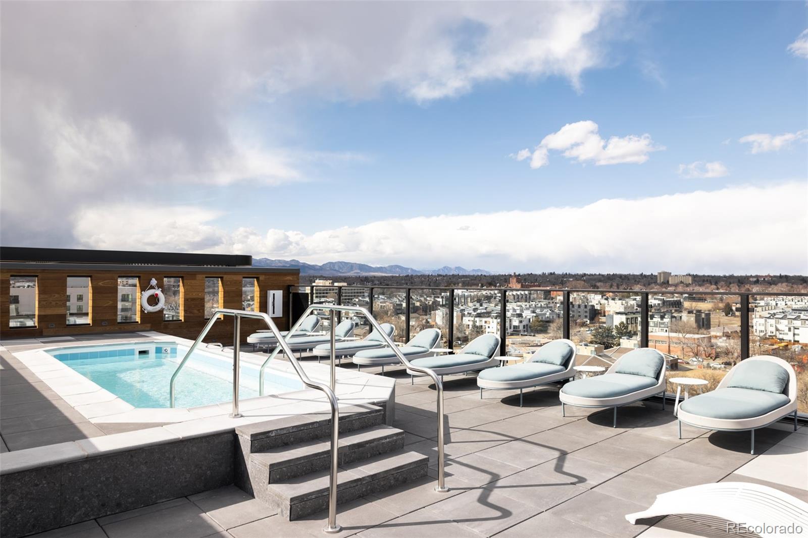 1521 Hooker Street, Unit 308 Denver, CO 80204 - Photo 19 of 31 a view of a patio with swimming pool table and chairs