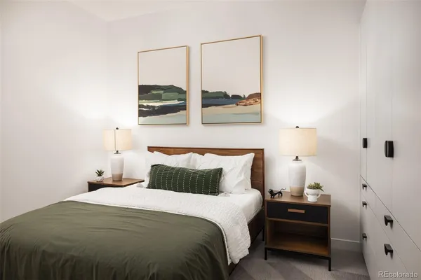 a bedroom with a bed and window