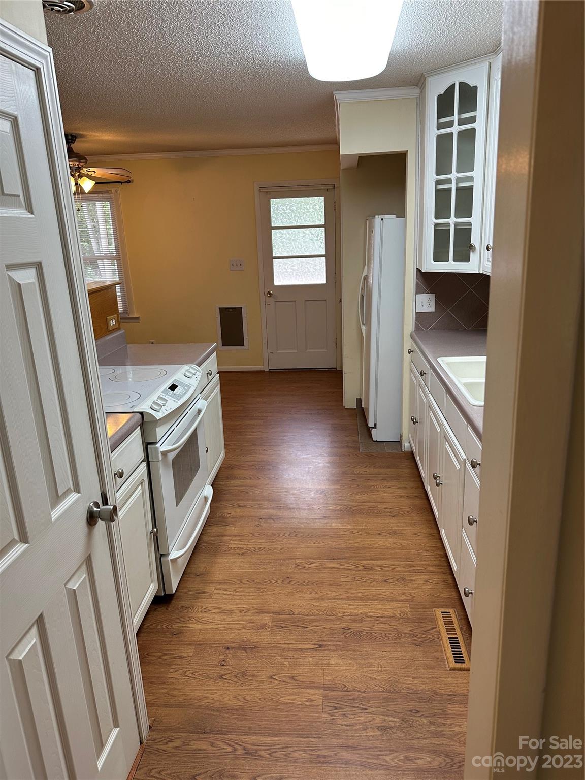140 Hillside Drive Salisbury, NC 28147 - Photo 15 of 29 a view of a kitchen in an empty room with a fireplace