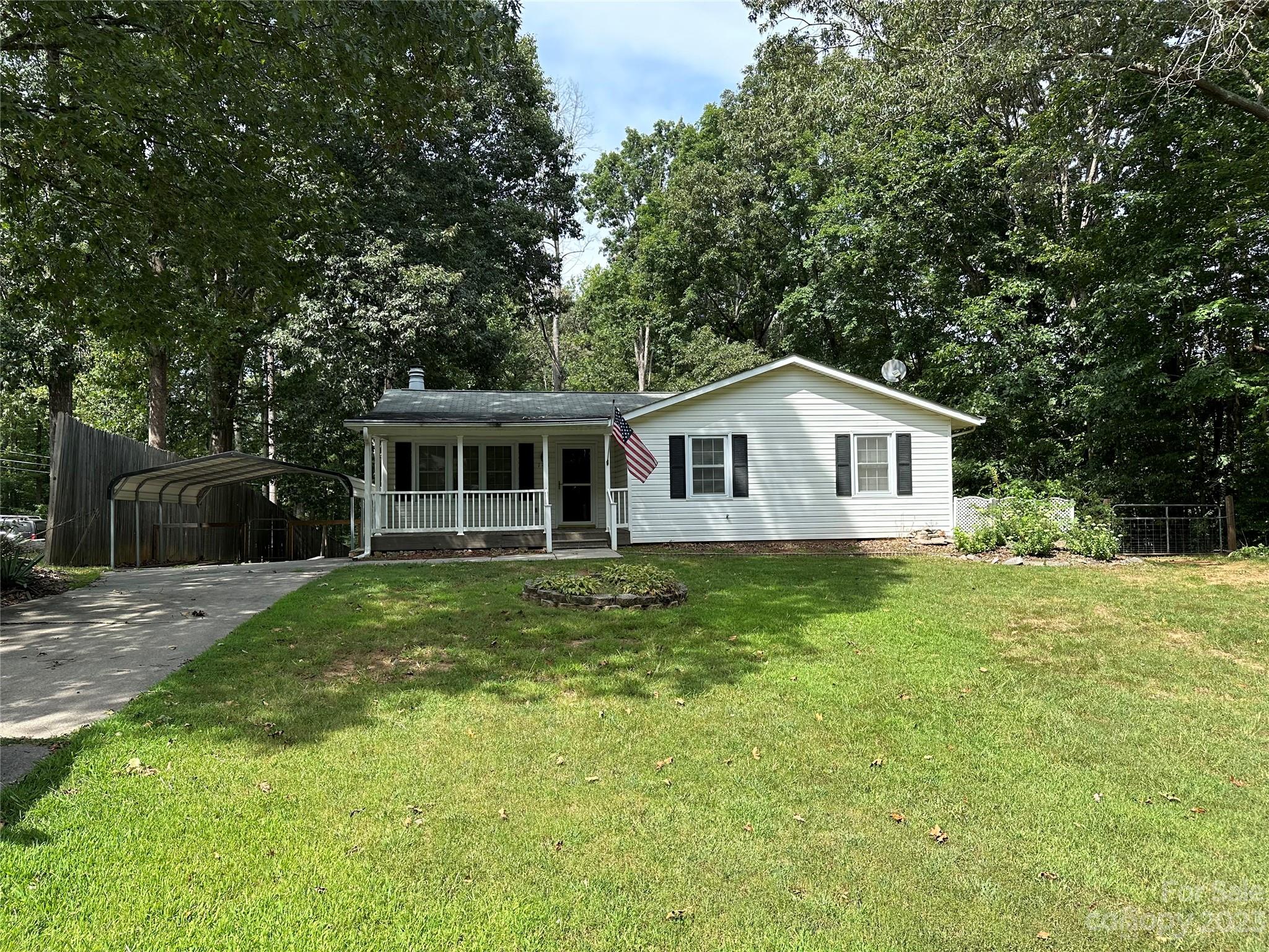 140 Hillside Drive Salisbury, NC 28147 - Photo 2 of 29 a swimming pool with wooden fence