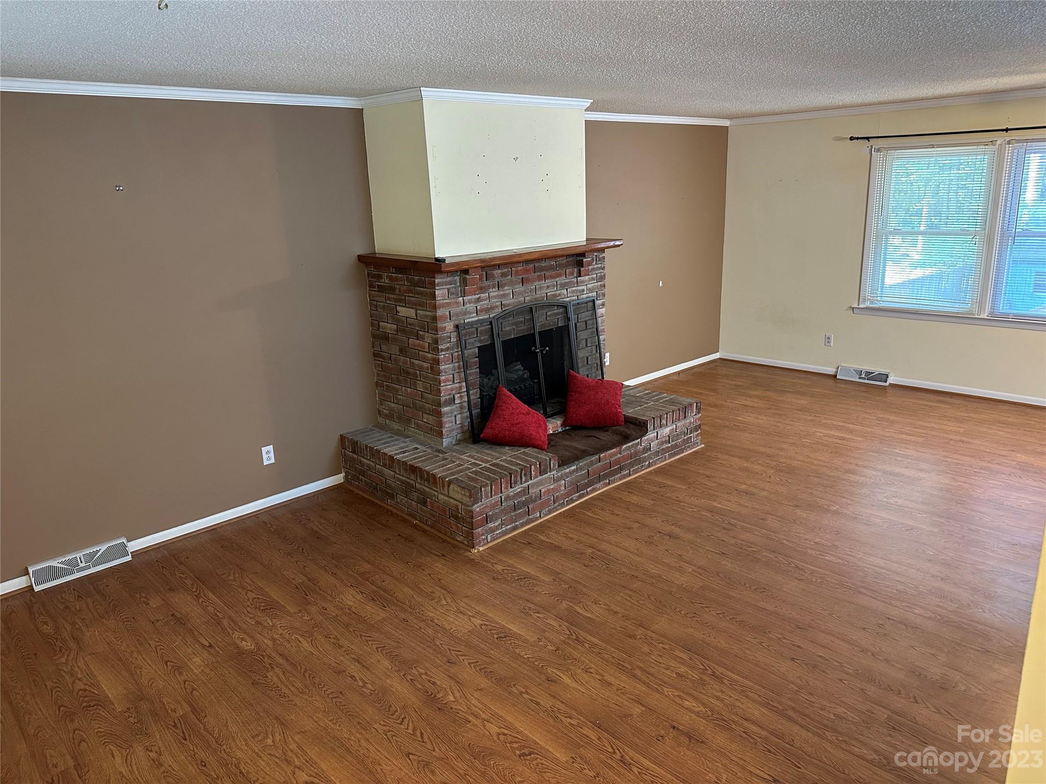 140 Hillside Drive Salisbury, NC 28147 - Photo 6 of 29 a living room with hard wood floors and a fireplace
