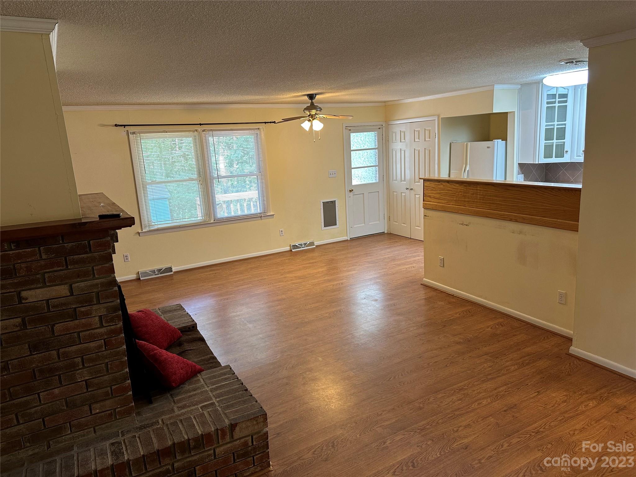 140 Hillside Drive Salisbury, NC 28147 - Photo 8 of 29 a view of an empty room with wooden floor and a window