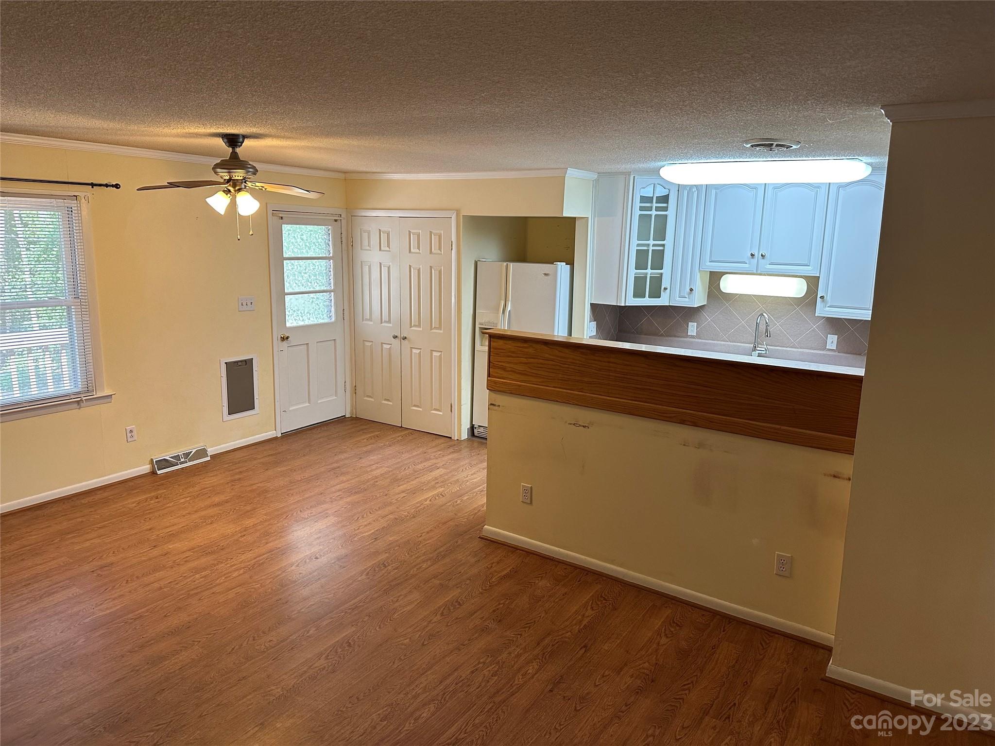 140 Hillside Drive Salisbury, NC 28147 - Photo 10 of 29 a view of a kitchen with wooden floor and a window
