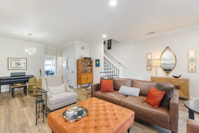 a bedroom with a bed a mirror and dresser