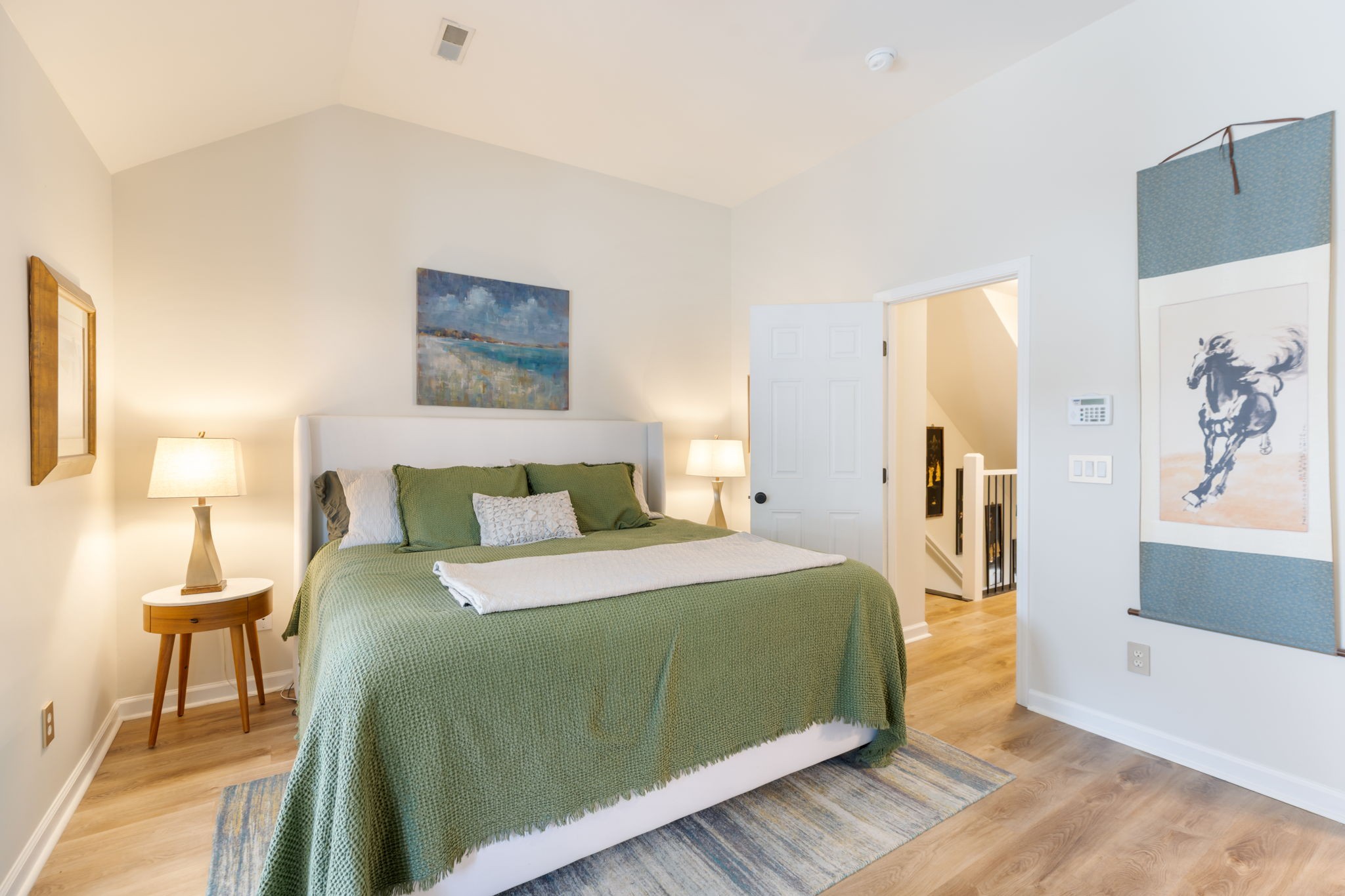 226 Pearl Street Franklin, TN 37064 - Photo 44 of 63 a bedroom with a bed and a painting on the wall