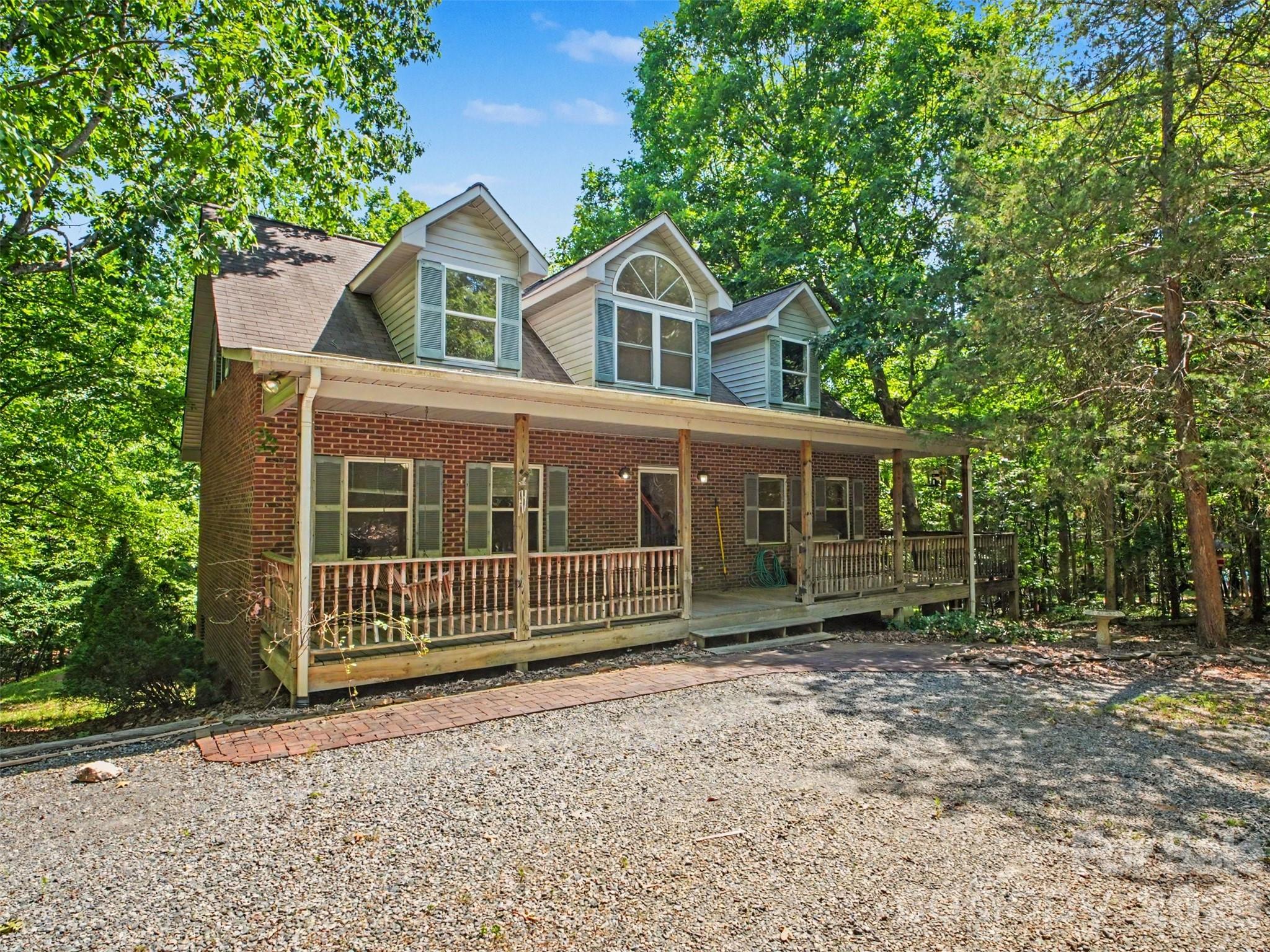 11109 Asbury Chapel Road Huntersville, NC 28078 - Photo 1 of 33 a front view of a house with a yard and garage