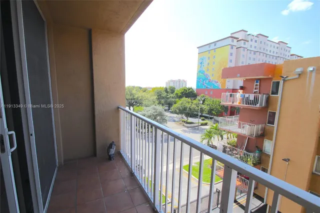 a view of a building with sitting area