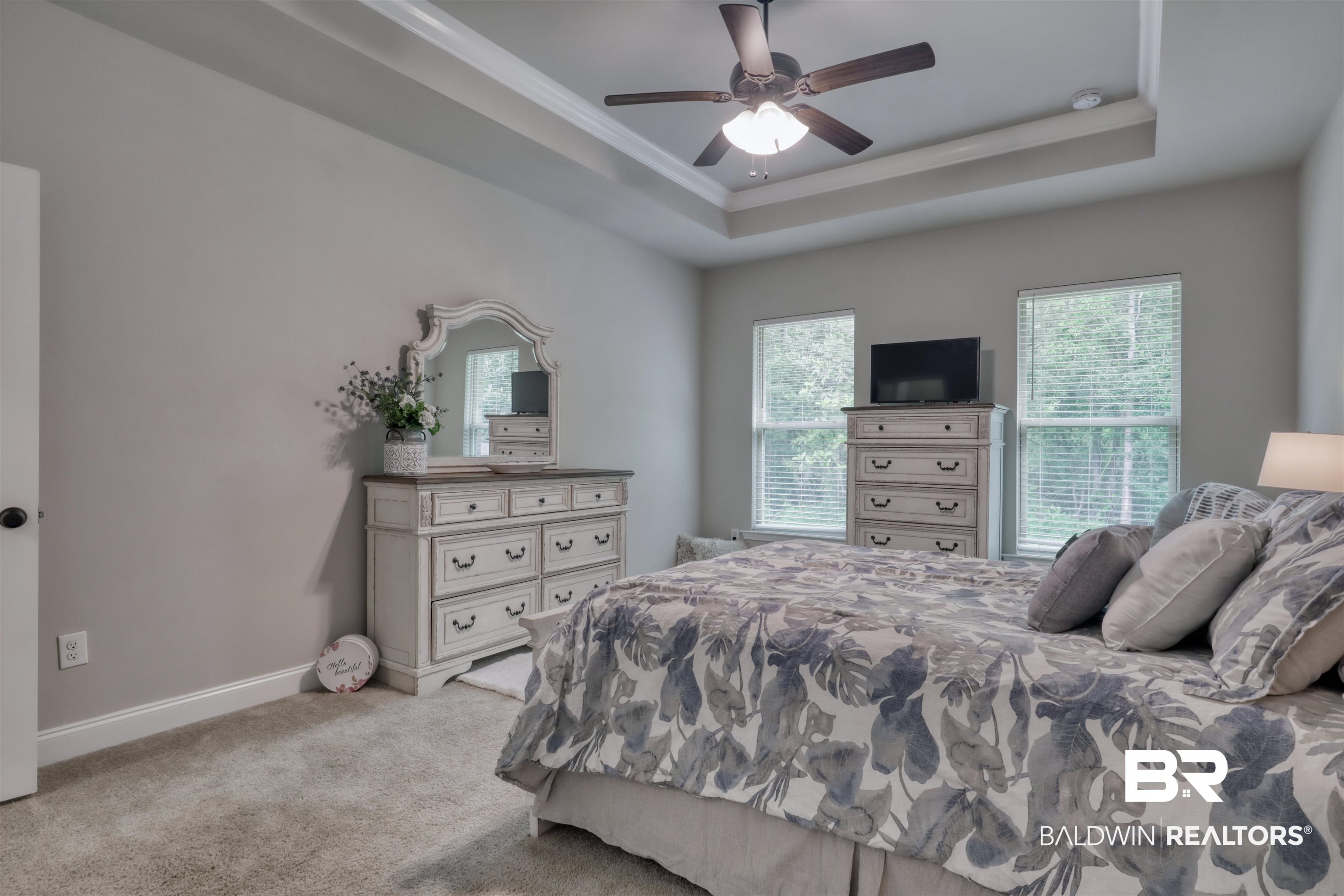 987 Gibson Court Foley, AL 36535 - Photo 17 of 34 Bedroom with ornamental molding, carpet flooring, baseboards, a raised ceiling, and a ceiling fan