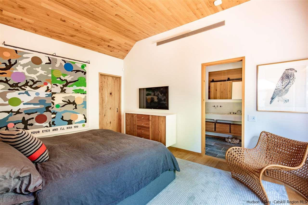 60 Ridgewood Road Kerhonkson, NY 12446 - Photo 11 of 31 a bedroom with a bed couch and a window