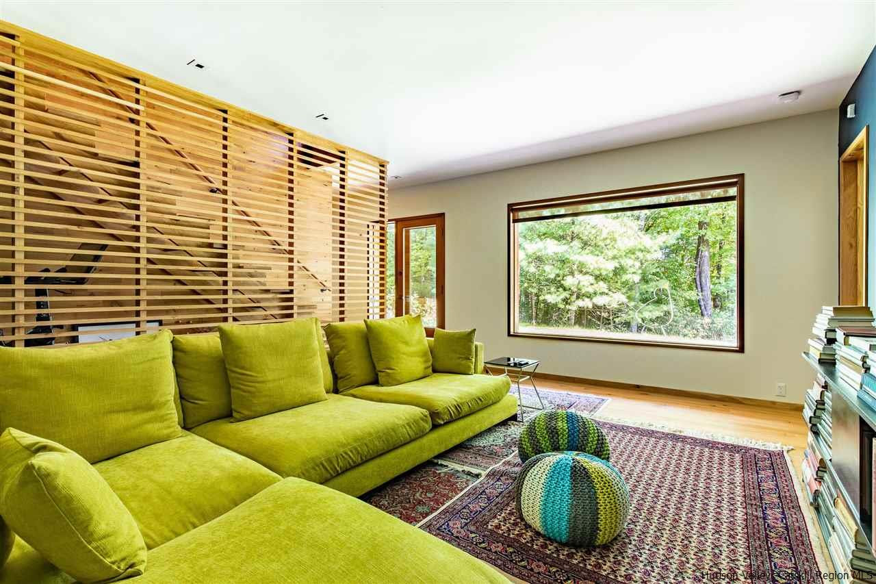 60 Ridgewood Road Kerhonkson, NY 12446 - Photo 16 of 31 a living room with furniture and a large window