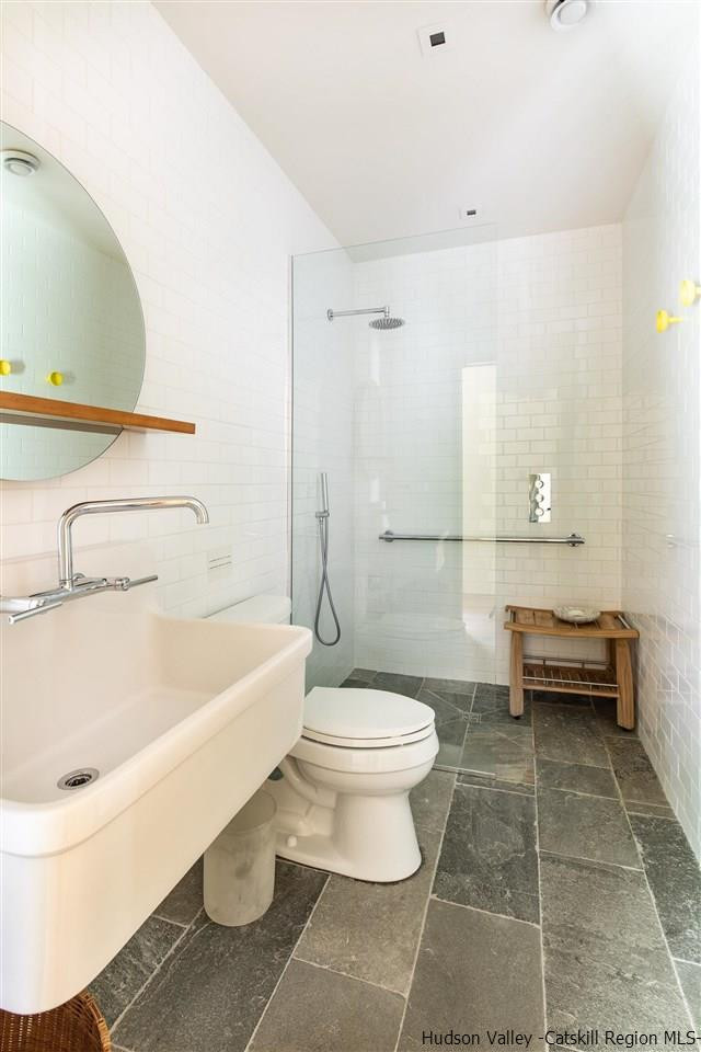 60 Ridgewood Road Kerhonkson, NY 12446 - Photo 23 of 31 a bathroom with a toilet a sink and bathtub