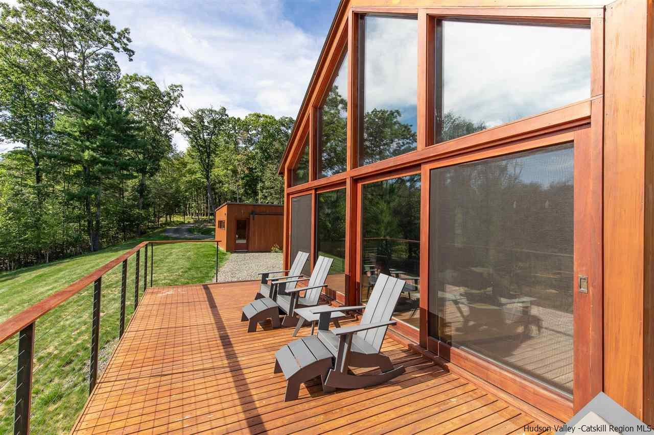 60 Ridgewood Road Kerhonkson, NY 12446 - Photo 25 of 31 a balcony with wooden floor table and chairs