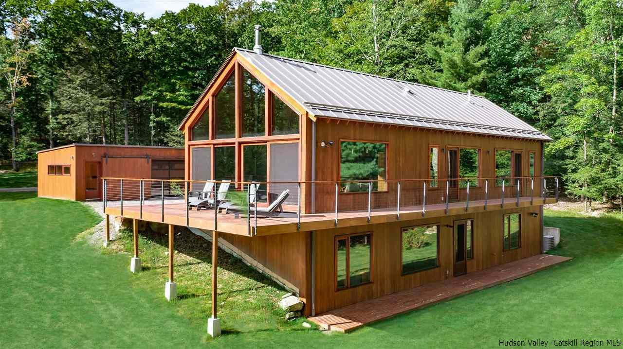 60 Ridgewood Road Kerhonkson, NY 12446 - Photo 3 of 31 a view of a house with backyard porch and sitting area