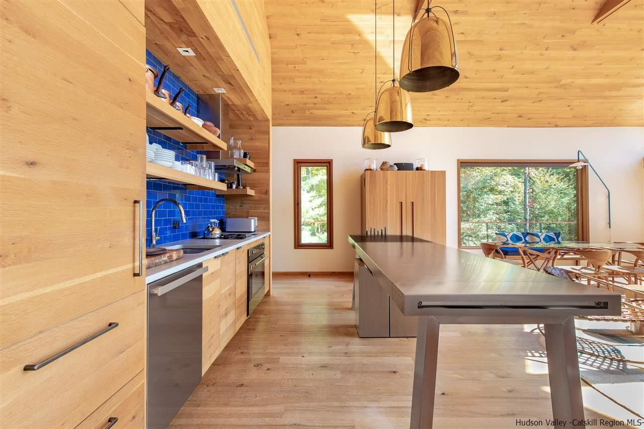60 Ridgewood Road Kerhonkson, NY 12446 - Photo 6 of 31 a kitchen with stainless steel appliances granite countertop a stove and a refrigerator