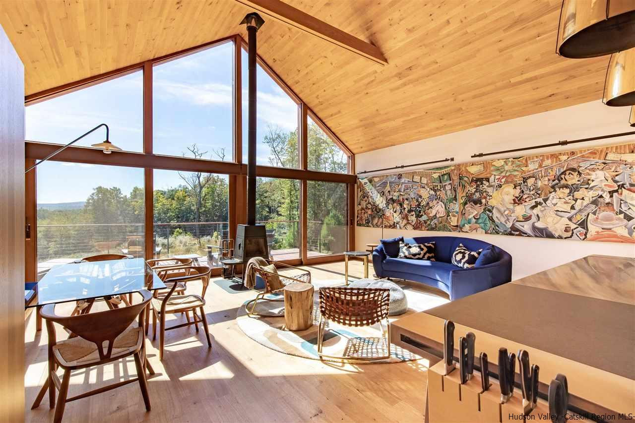 60 Ridgewood Road Kerhonkson, NY 12446 - Photo 8 of 31 a living room with furniture and a floor to ceiling window