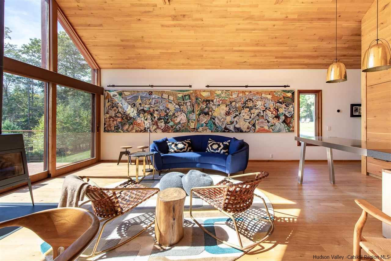 60 Ridgewood Road Kerhonkson, NY 12446 - Photo 9 of 31 a living room with furniture and a floor to ceiling window