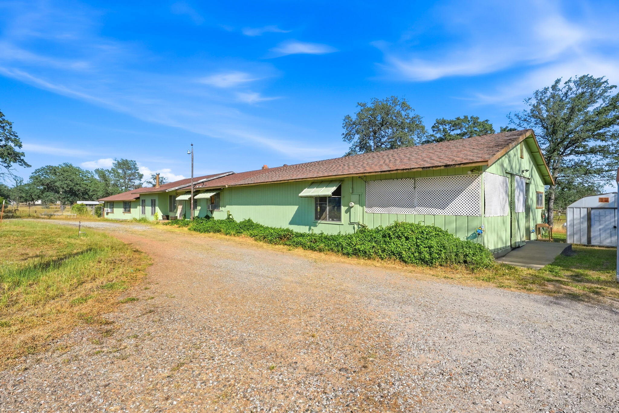 22189 Old Alturas Road Redding, CA 96003 - Photo 50 of 70 a view of a house with a yard and lake view
